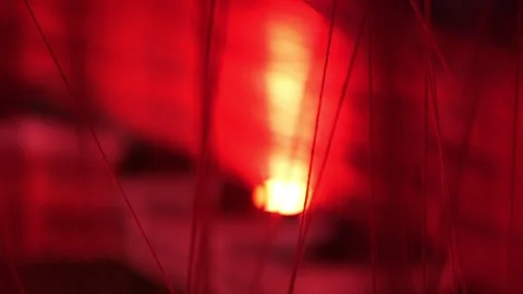 Closeup of abstract red light and threads, an artistic fusion of glow and Stock Footage 277070859