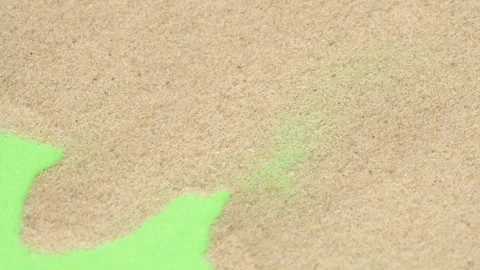 Closeup abstract sand transition blowing over green screen chroma key background Stock Footage 253537200