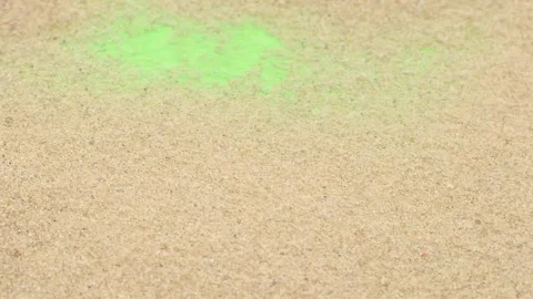 Closeup abstract sand transition blowing over green screen chroma key background Видео 255628715