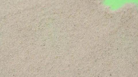 Closeup abstract sand transition blowing over green screen chroma key background Video stock 262717744