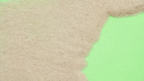 Closeup abstract sand transition blowing over green screen chroma key background Stock Footage 265539447