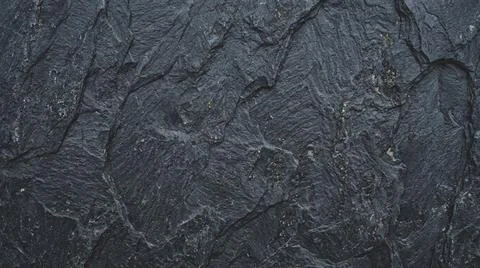 Closeup Abstract Texture of Dark Rock Surface. Stock Illustration