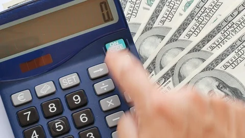 Closeup accountant hand making calculations dollars us bills Stock Footage 89948164