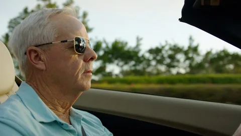 Closeup Of Active Senior Man Driving In His Luxury Convertible In Sunny Florida Vídeos de archivo 88019552