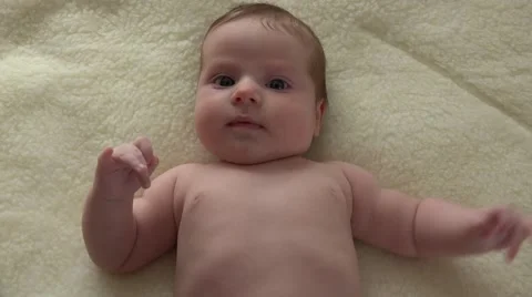 Closeup Activity of Infant Lying on Fur. 4k Ultra HD Stockbeeldmateriaal 48144514