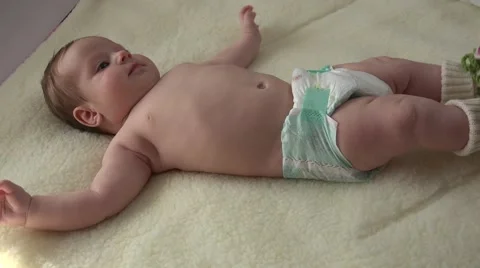 Closeup Activity of Infant Lying on Fur. 4k Ultra HD Stock Footage 48144543