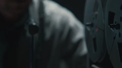 Closeup of An agent smoking while wire tapping 库存影片 258224683