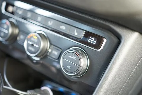 Closeup of the air conditioning and control panel in a modern car Stock Photos
