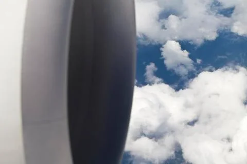 Closeup of Airplane Engine above clouds Stock Photos