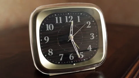Closeup alarm clock on a bed stand 1080p 25fps Video stock 99257806