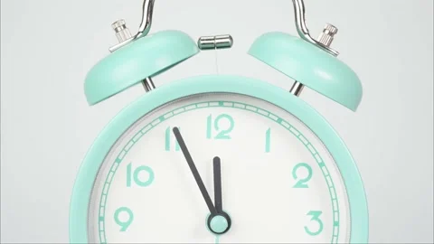 Closeup Alarm clock isolated Twelve o'clock Time lapse 30 minute. Stock Footage 143235487
