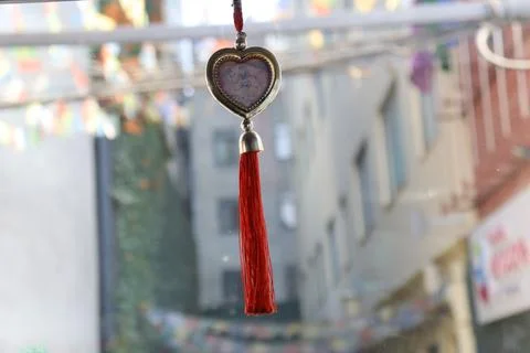Closeup of amulets hanging in front console of the car, bad vibes protection Stock Photos