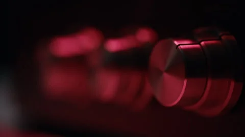 Closeup analog knobs adjusting volume on vintage player indoors. Retro tuner Stock-Footage 332665689