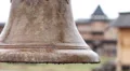 Closeup of ancient alarm bell at medieval town, old log fortress, history museum HD Footage