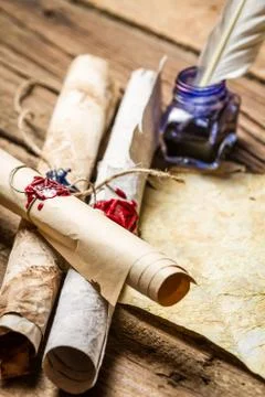 Closeup of ancient scrolls writing by feather with blue ink 스톡 사진