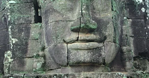 Closeup of Ancient Stone Face at Bayon Temple in Cambodia Stock Footage 68105092