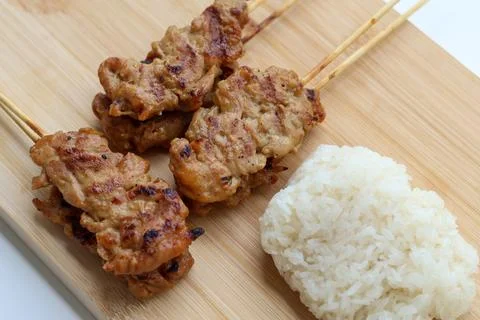 Closeup and High angle view of Grilled pork skewers and sticky rice Stock Photos