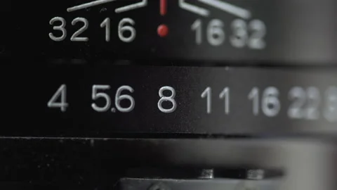 Closeup of the aperture being adjusted on a lens Stock Footage 136949366