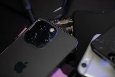 Closeup of Apple iPhone 13 Pro camera and older iPhone in background Stock Photos