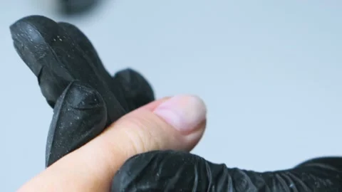 Closeup applying transparent nail base coat Stockbeeldmateriaal 131041430