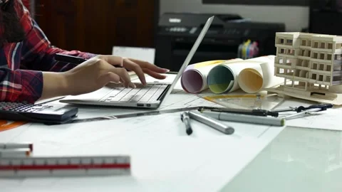 Closeup of architect woman working on a project. Architect with blueprints on Видео 336568155