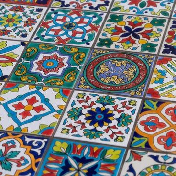 Closeup of an array of vibrant multicolored tiles with diverse patterns and desi Stock Photos