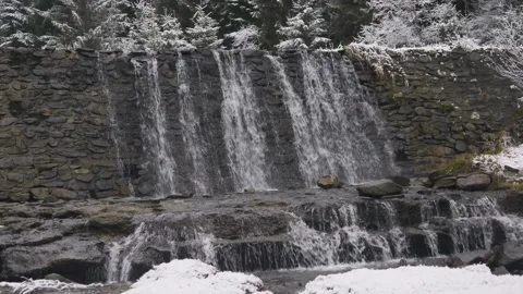Closeup of artificial waterfall on mountain path Stock Footage 144656513