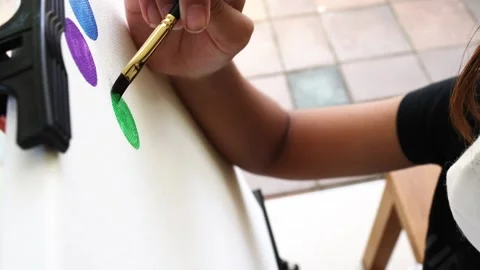 Closeup artist hand using brush acrylic painting on canvas frame Stock Footage 196561711