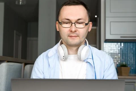Closeup of asian man using laptop for online education or work from home. Stock Photos