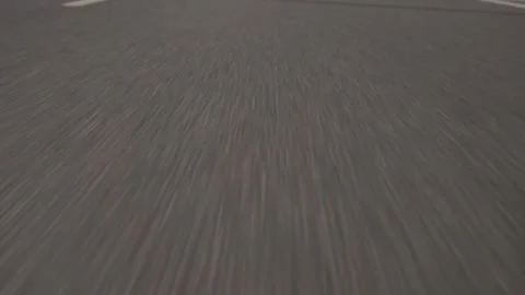 Closeup of asphalt road with fast movement. Fooage. Summer road with white Stock Footage 219484192