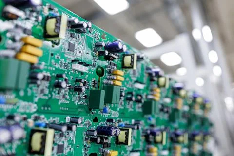 Closeup of assembled power electronics circuit board in modern manufacturin.. Stock Photos