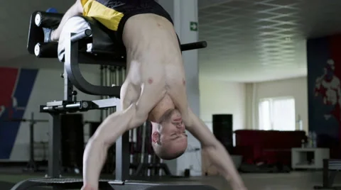 Closeup of athlete doing ghd sit ups at the gym Video stock 65279461