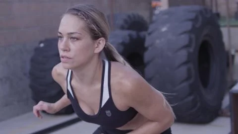 Closeup of athletic woman's face while she works out Stock Photos