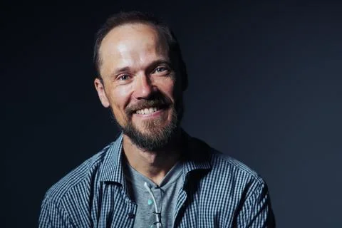 Closeup of authentic smiling middle age man smiling looking at camera Stock Photos