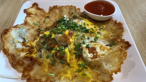 Closeup Authentic Thai Fried Crispy Oyster Omelette Pancake With Dipping Sauce Stock Footage 233229349