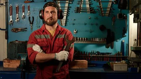 Closeup of auto mechanic. Auto repair service. Working tools background. Auto Stock Photos