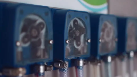 Closeup of automatic chemical supply system at laundry industrial equipment Stock Footage 153971339