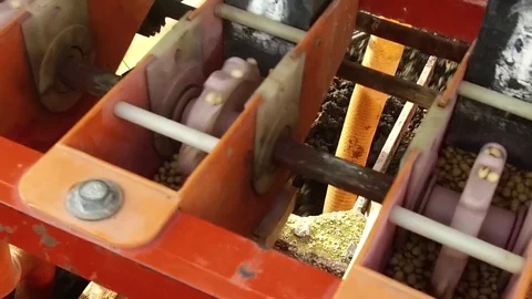 Closeup of automatic seed cum fertilizer drill machine Stock Footage 77572872