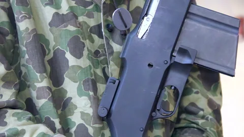 Closeup Of An Automatic Weapon Held By Person In Uniform Stock Footage 304009551