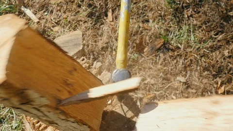 Closeup of an Axe Splitting Tree Log into Firewood in Slow Motion Stock Footage 85493844