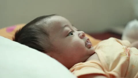 Closeup of a baby boy on the bed Stock Footage 333889397