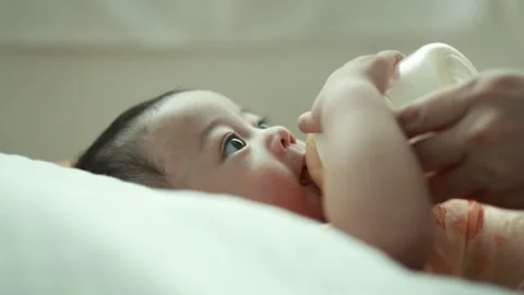 Closeup of a baby boy on the bed Stock Footage 333889413