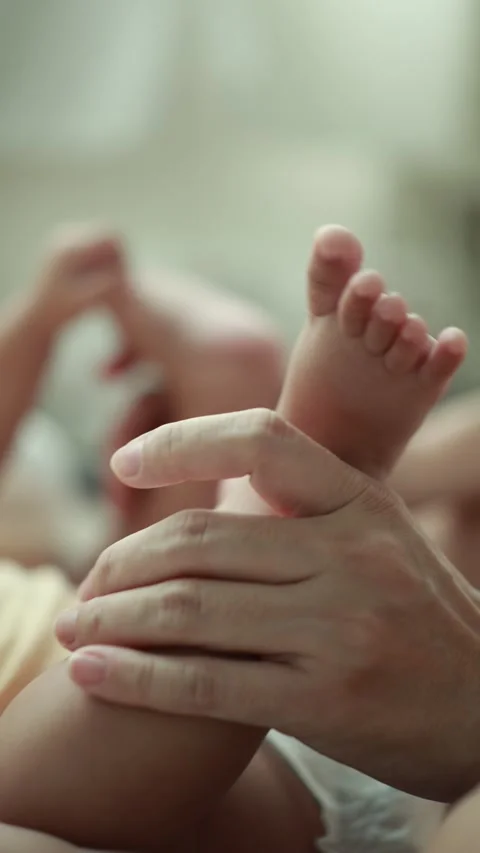 Closeup of a baby boy on the bed Stock Footage 333889422