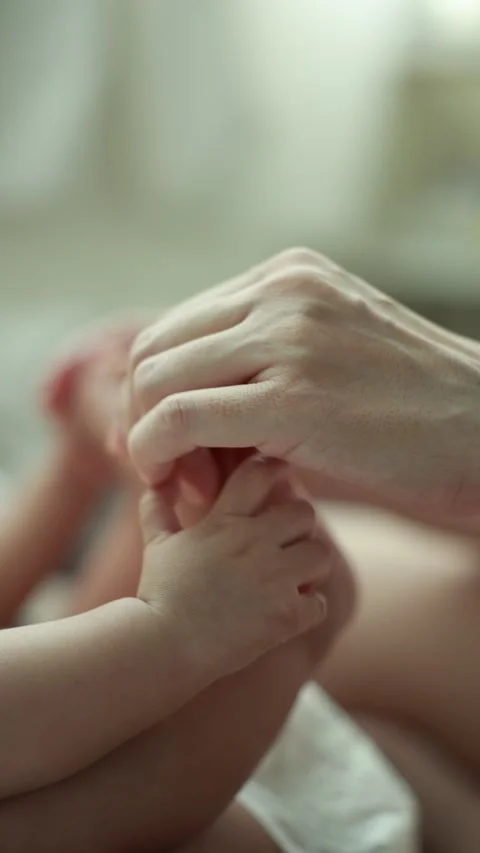 Closeup of a baby boy on the bed Stock Footage 333889438