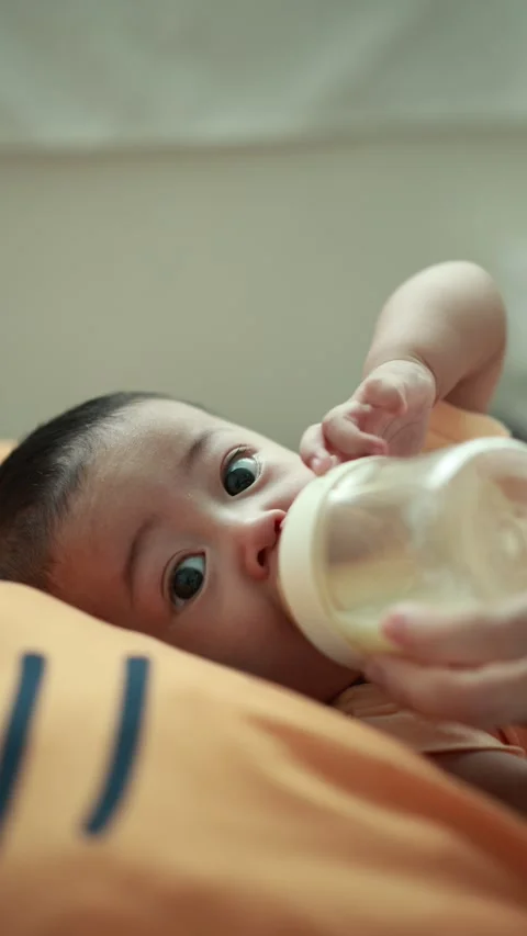 Closeup of a baby boy on the bed Stock Footage 333889446