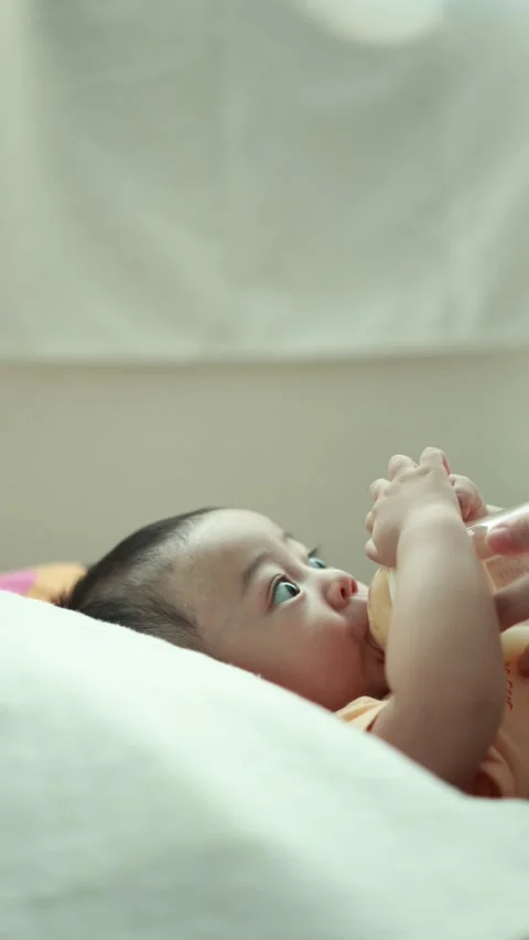 Closeup of a baby boy on the bed Stock Footage 333889478