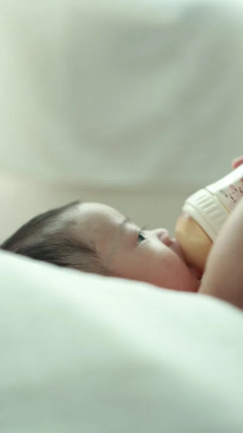Closeup of a baby boy on the bed Stock Footage 333889481