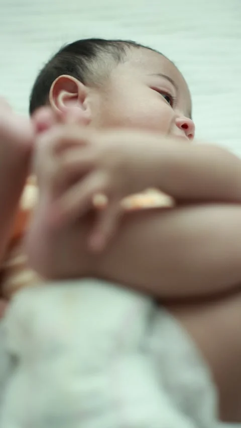 Closeup of a baby boy on the bed Stock Footage 333889498