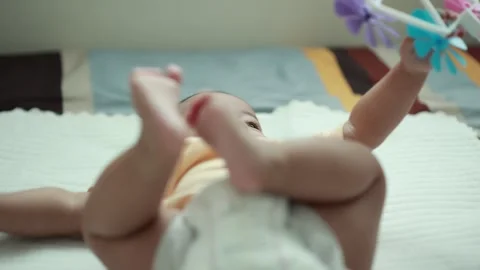 Closeup of a baby boy on the bed Stock Footage 333889499