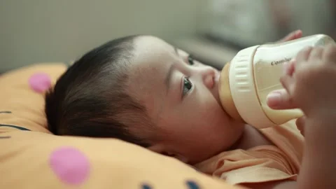 Closeup of a baby boy on the bed Stock Footage 333889507